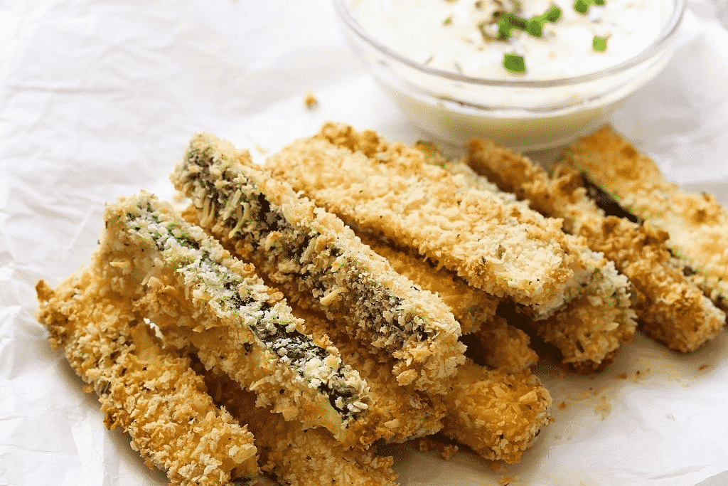 A plate of Fried Zucchini with dipping sauce